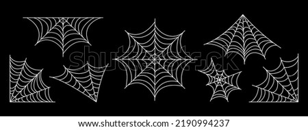 Spider web set. Halloween hand drawn cobweb collection. Vector illustration isolated on black background.	
 Royalty-Free Stock Photo #2190994237