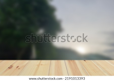 Empty Wood Plate Top Table On Flower And Green Leaf Background