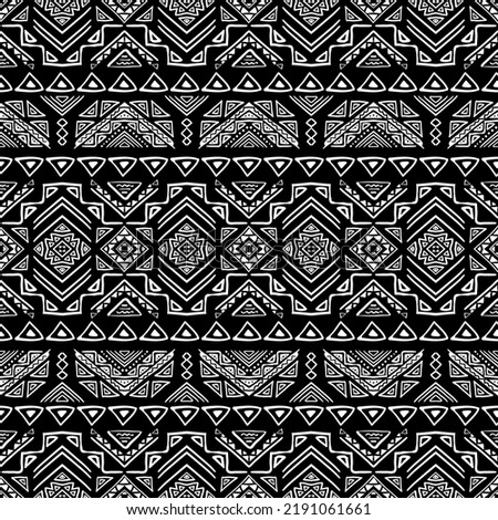 Seamless pattern with tribal aztec motives. Black and white abstract wallpaper in boho style with hand drawn elements. 