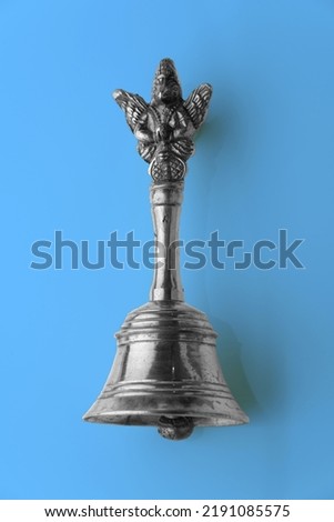 Monochromatic Puja Bell for Prayers. Useful in the Temple, Mandir. Seamless Sky Blue Color Background.