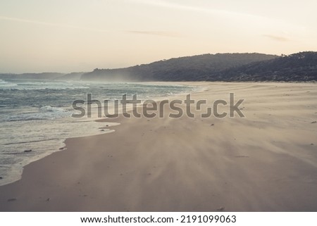 Long empty Australian beach at sunrise