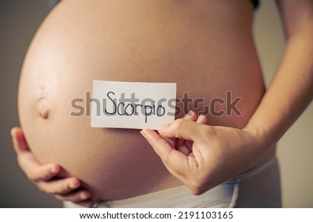 A pregnant mom having a Scorpio baby. Scorpio sign.