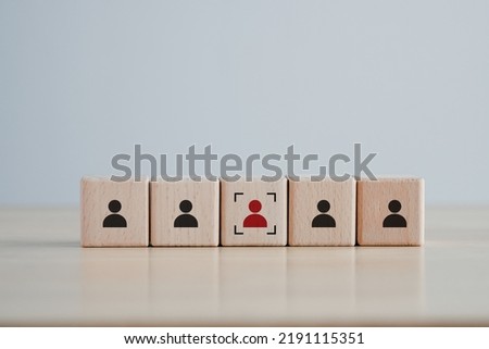 Business hiring and recruitment selection. Career opportunity. Human Resource Management. Focus red human icon on wooden block. Choice of employee leader from the crowd. Royalty-Free Stock Photo #2191115351