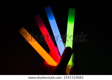Chemical lights waved by the audience at a concert Royalty-Free Stock Photo #2191124085