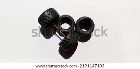 Black  rubber toys wheels with axles dismantled from the toys car