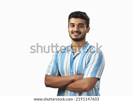 Indian handsome young adult wearing blue strip shirt and smiling isolated on white background  Royalty-Free Stock Photo #2191147603