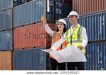 Caucasian two businessman and businesswoman working in container site.  Attractive engineer people discussion orders and product at warehouse logistic in cargo freight ship for import export in harbor Royalty-Free Stock Photo #2191150227
