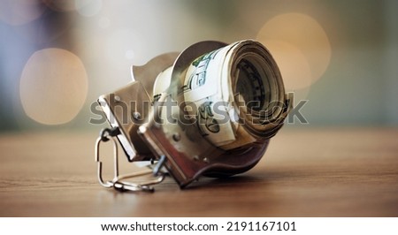. Bribe, corruption and money laundering with handcuffs on banknotes and jail time for corrupt business deal or tax fraud. Bribing or soliciting influence with cash is criminal and a financial crime Royalty-Free Stock Photo #2191167101