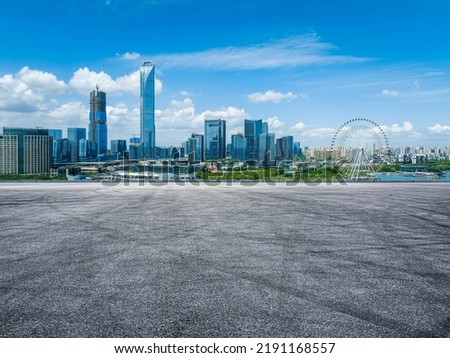 Asphalt road and city skyline with modern building in Suzhou, China. Royalty-Free Stock Photo #2191168557
