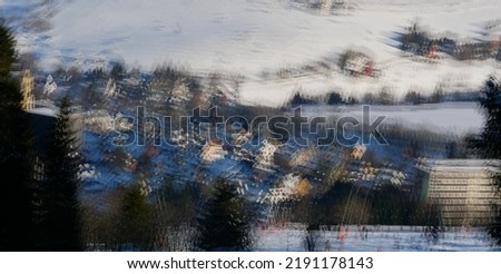 fuzzy winter landscape of snow and a valley