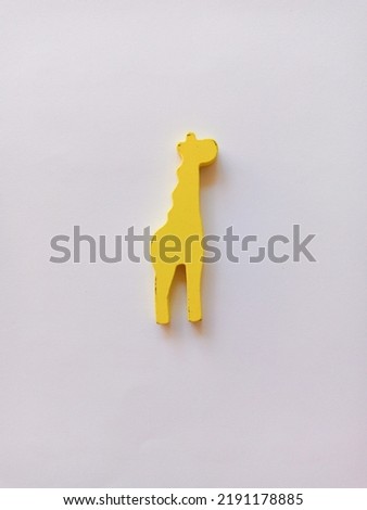 Yellow giraffe kids toy isolated in white background.