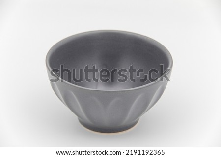 Empty ceramic grey bowl isolated on white background