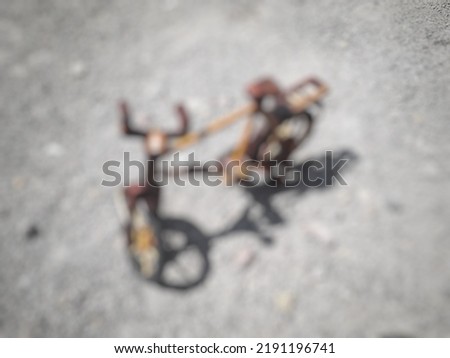 Defocused abstrack background of wooden bicycle on the sand