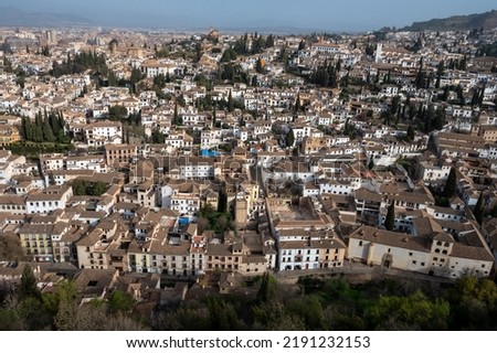 Aerial panoramic view on buildings, old district, mountains and palace, world heritage city Granada, Andalusia, Spain in spring