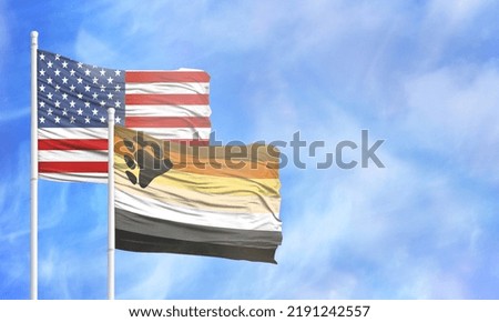 Waving American flag and flag of Bear Brotherhood.
