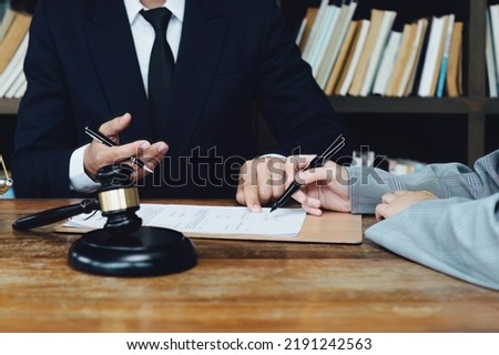 Discussing legal matters and signing important documents.