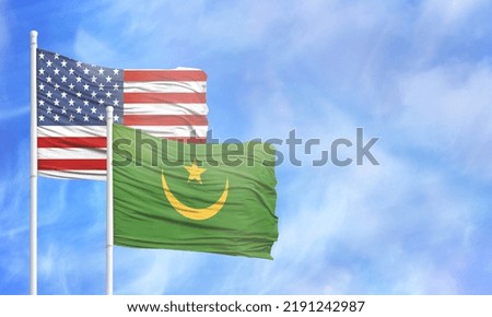 Waving American flag and flag of Mauritania.