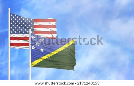 Waving American flag and flag of Solomon Islands.
