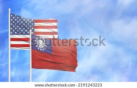 Waving American flag and flag of Myanmar Burma.