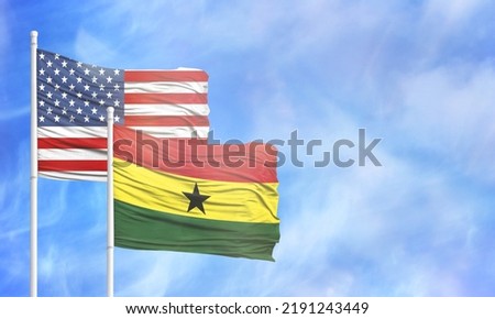 Waving American flag and flag of Ghana.
