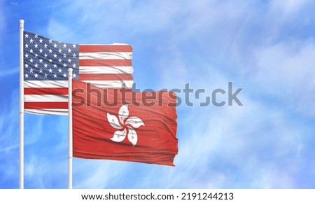 Waving American flag and flag of Hong Kong.