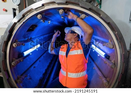 Maintenance engineer perform boiler spray nozzle leakage check inspectiion at the pressure tank during plant inoperation outage shutdown
 Royalty-Free Stock Photo #2191245191