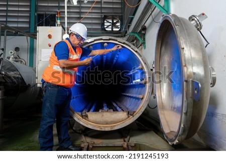 Maintenance engineer perform boiler spray nozzle leakage check inspectiion at the pressure tank during plant inoperation outage shutdown
 Royalty-Free Stock Photo #2191245193