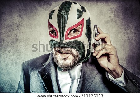 Trouble, aggressive executive suit and tie, Mexican wrestler mask