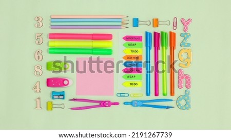 Back to scool or business layout with stationery on pastel green background. Flat lay