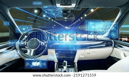 Interior of autonomous car. Driverless vehicle. Driving assist system. HUD (Heads up display). Royalty-Free Stock Photo #2191271559