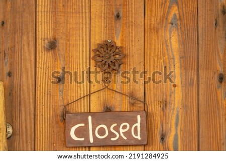 CLOSED sign hanging on the door.
