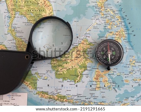 world map, world map with magnifying glass and compass
