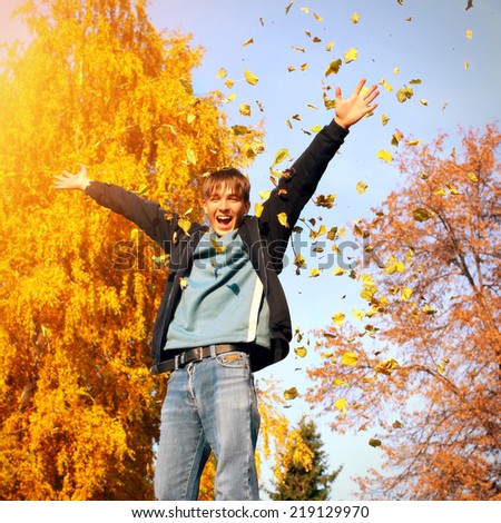 Toned photo of Happy Teenager in the Autumn Park