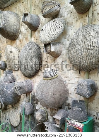 Some used bamboo handicrafts hanging on the wall made of bamboo