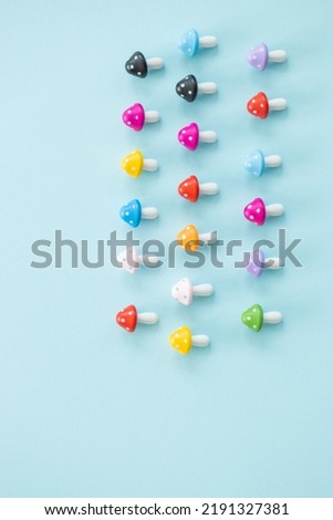 Figures in the form of colored mushrooms on a blue background