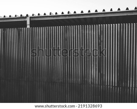 large metal fence, black and white photo, old concept