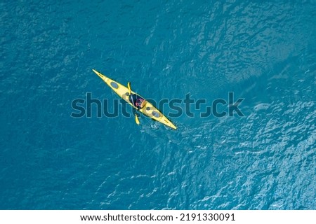 Kayak boat blue turquoise water sea, sunny day. Concept banner travel, aerial top view. Royalty-Free Stock Photo #2191330091