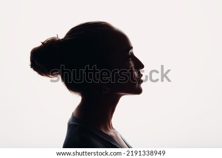Young woman silhouette beautiful profile portrait isolated. Royalty-Free Stock Photo #2191338949