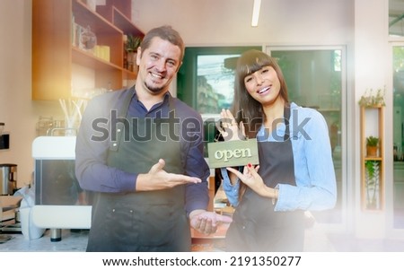 Portrait A caucasian male barista couple wearing an apron. standing at the bar counter coffee shop and restaurant concept Starting a small business owner, lifestyle, leisure, food, and beverage, cafe