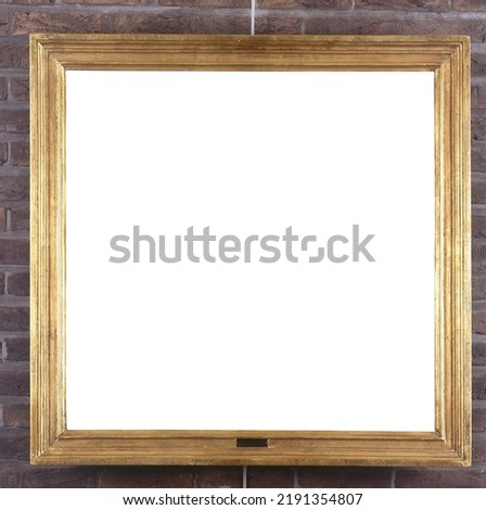 Picture frame hung on the concrete wall by a picture rail