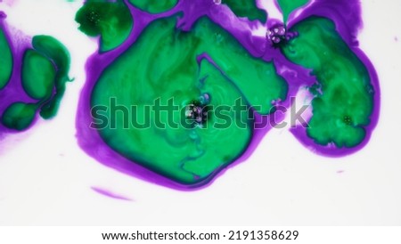 Abstract colors, backgrounds and textures. Oil coloring in milk creating bright colorful abstract backgrounds. Chemical experiment.