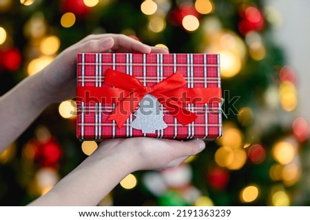 hands holding christmas gift box. christmas decor