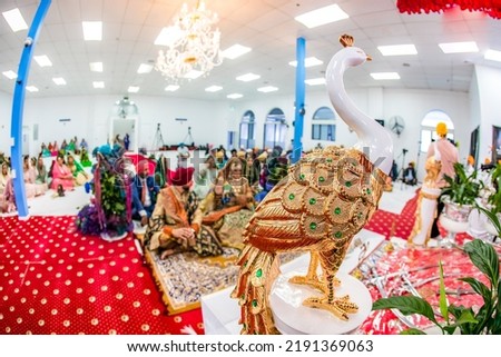 Indian Punjabi Sikh wedding at gurdwara interiors, altar, ritual items and decorations