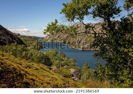 Amazing views in South Norway coastline, fjords, lakes, beautiful nature. Kids and adults traveling in Norway summertime