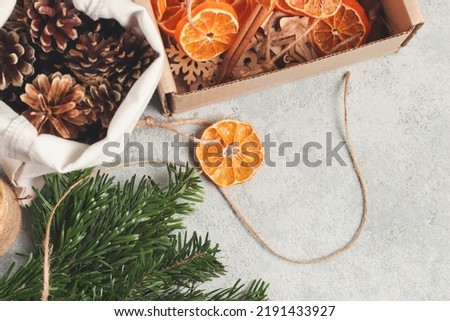 Zero waste and eco friendly christmas concept. Natural decorations and branches of a Christmas tree on the table, top view