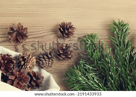 Zero waste and eco friendly christmas concept. Natural decorations and branches of a Christmas tree on the table, top view