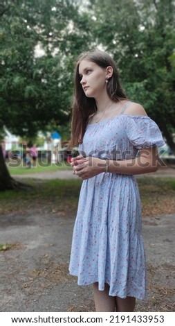 Photo of attractive young charming happy girl, pensive mood, enjoy weekend outdoors outside city