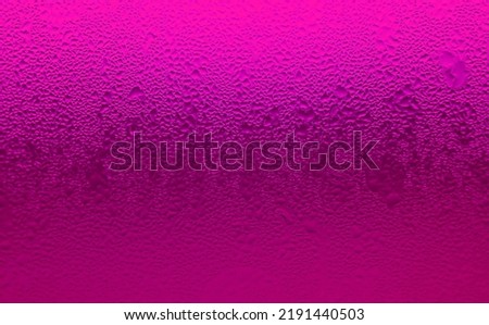 Closeup Texture of Water Droplets on Hot Pink Chilled Cocktail Glass