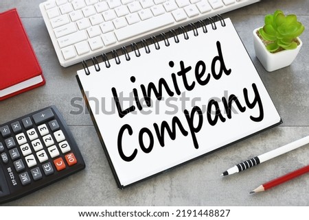 Limited company work desk red notepad keyboard text on notepad top view Royalty-Free Stock Photo #2191448827