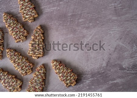 Christmas tree Cookies Laid Out on Rustic Table with Copy Space